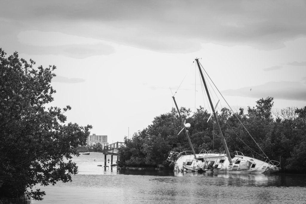 Flooded sailboat tipped over from Hurricane Helene in Saint Petersburg, Florida